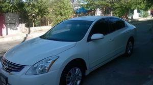 Nissan Altima  impecable. TEL 